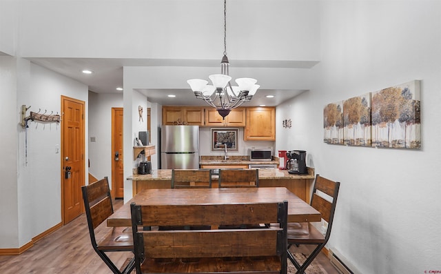 50827 N 550th Hwy Unit 329, Durango, CO 81301 - dining area featuring light wood-type flooring, a chandelier, and recessed lighting