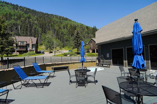 50827 N 550th Hwy Unit 329, Durango, CO 81301 - wooden terrace with a wooded view and outdoor dining area
