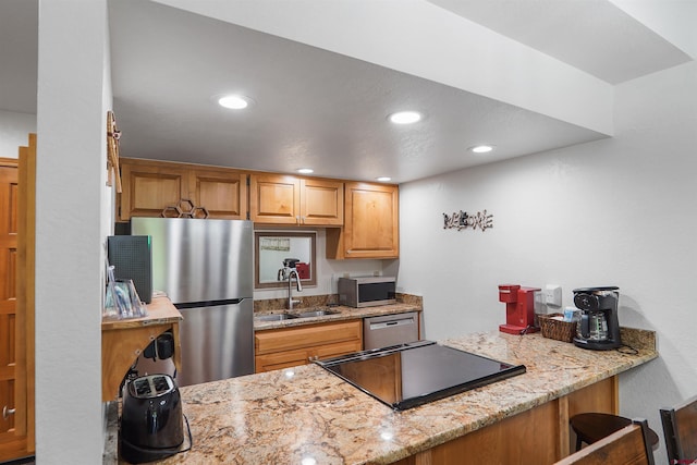 50827 N 550th Hwy Unit 329, Durango, CO 81301 - kitchen featuring stainless steel appliances, recessed lighting, light stone counters, and a peninsula