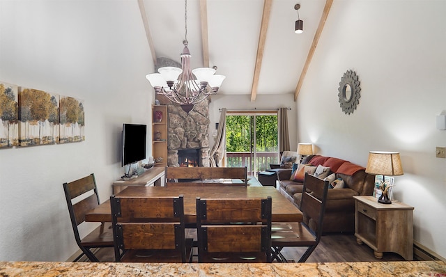 50827 N 550th Hwy Unit 329, Durango, CO 81301 - dining area featuring a chandelier, beamed ceiling, wood finished floors, high vaulted ceiling, and a stone fireplace