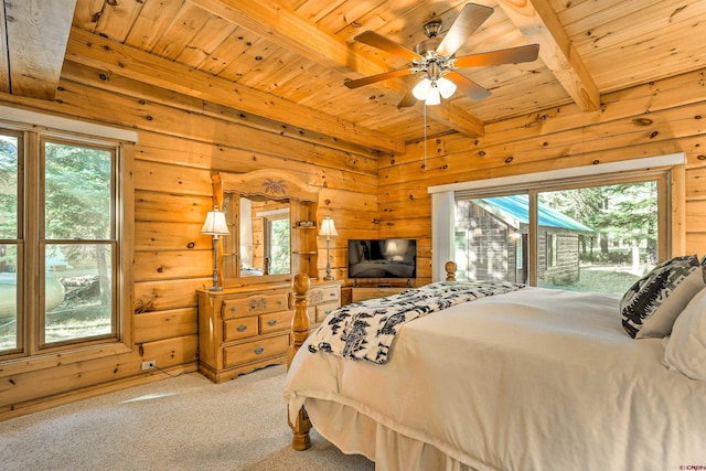 601 W Grimes Creek Rd, Bayfield, CO 81122 - bedroom with a wooden ceiling with exposed beams, carpet flooring, wood walls, and a ceiling fan