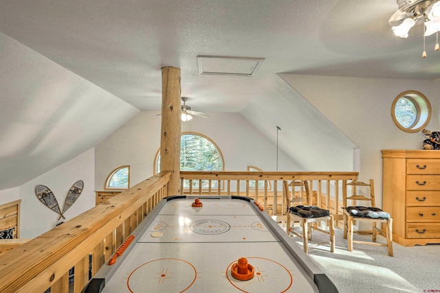 601 W Grimes Creek Rd, Bayfield, CO 81122 - rec room with a ceiling fan, vaulted ceiling, carpet, a textured ceiling, and attic access
