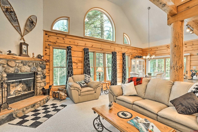 601 W Grimes Creek Rd, Bayfield, CO 81122 - living room with high vaulted ceiling, plenty of natural light, carpet floors, a chandelier, and a fireplace