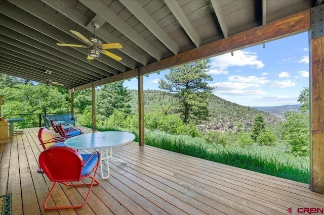 444 Which Way, Ridgway, CO 81432 - wooden terrace featuring a mountain view, ceiling fan, and outdoor dining area