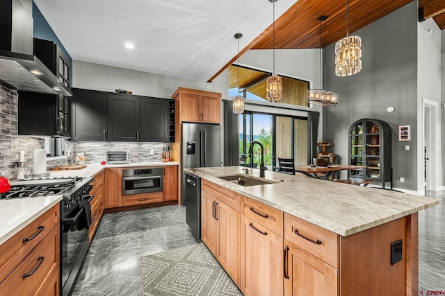 2161 Scout Ridge Rd, Durango, CO 81301 - kitchen featuring black appliances, wall chimney exhaust hood, light countertops, dark marble finish flooring, and a high ceiling