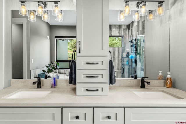 2161 Scout Ridge Rd, Durango, CO 81301 - full bathroom with double vanity, a chandelier, and a shower with door