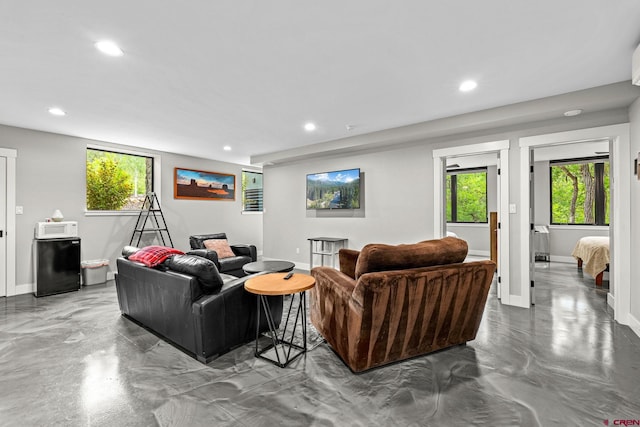 2161 Scout Ridge Rd, Durango, CO 81301 - living room featuring recessed lighting, healthy amount of natural light, and concrete floors