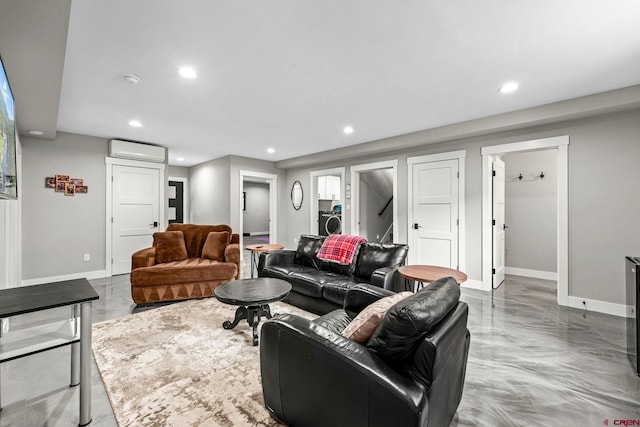 2161 Scout Ridge Rd, Durango, CO 81301 - living room with light marble finish flooring, recessed lighting, a wall unit AC, and washer / clothes dryer