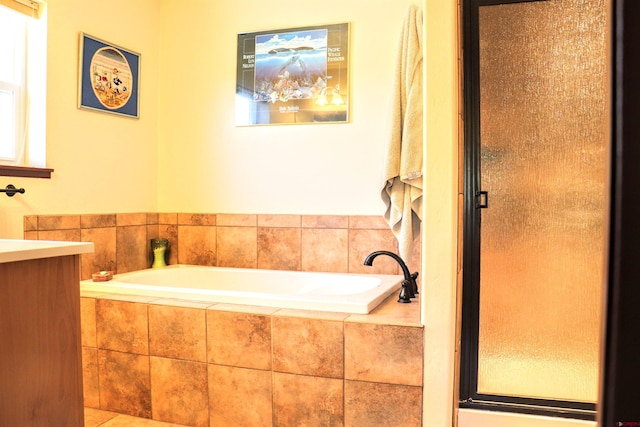 521 Alta Lakes Ave, Montrose, CO 81403 - full bathroom featuring a garden tub, a shower stall, and vanity