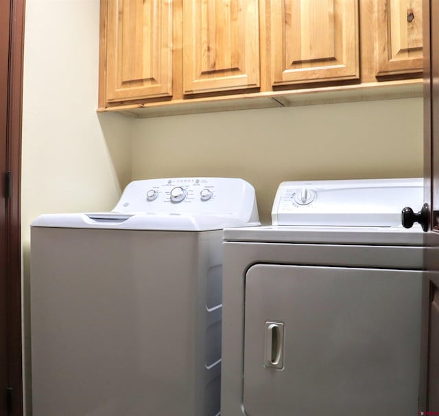 521 Alta Lakes Ave, Montrose, CO 81403 - laundry area with washing machine and clothes dryer and cabinet space