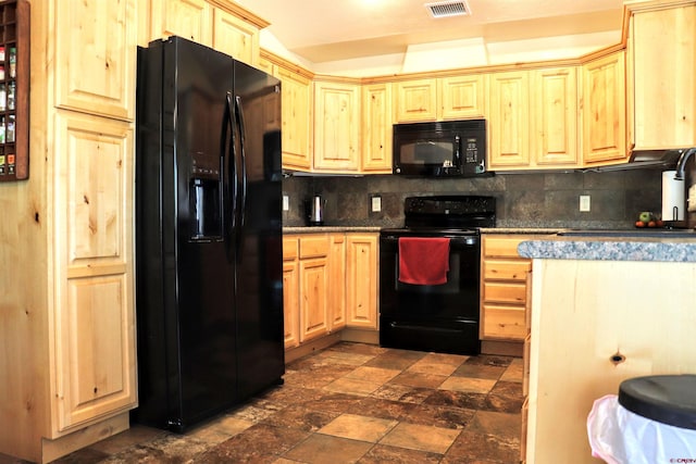 521 Alta Lakes Ave, Montrose, CO 81403 - kitchen with black appliances, decorative backsplash, and dark stone finish floors