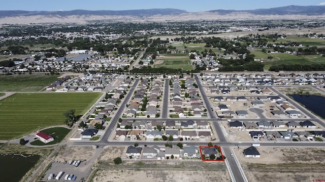 521 Alta Lakes Ave, Montrose, CO 81403 - view of property location with property boundaries highlighted, a water and mountain view, and nearby suburban area