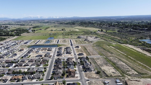 521 Alta Lakes Ave, Montrose, CO 81403 - aerial view of property and surrounding area with a mountainous background and nearby suburban area