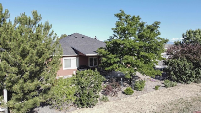 521 Alta Lakes Ave, Montrose, CO 81403 - view of side of property featuring stucco siding