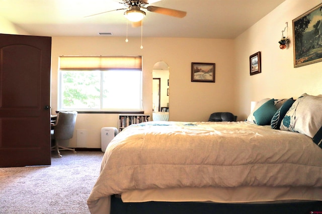 521 Alta Lakes Ave, Montrose, CO 81403 - carpeted bedroom featuring arched walkways and a ceiling fan