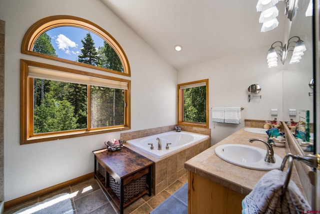 261 Aspen Dr, Durango, CO 81301 - full bath with double vanity, a garden tub, recessed lighting, high vaulted ceiling, and tile patterned floors