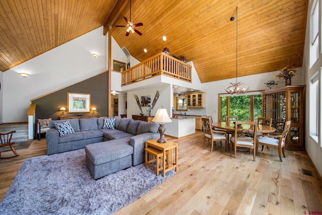 261 Aspen Dr, Durango, CO 81301 - living room featuring high vaulted ceiling, a chandelier, light wood-style flooring, a wooden ceiling with exposed beams, and ceiling fan