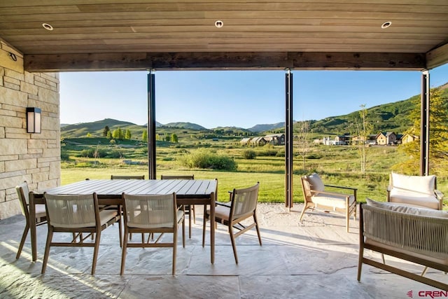 33 Aperture Ln, Crested Butte, CO 81224 - view of patio / terrace with a mountain view, outdoor dining space, and a view of rural / pastoral area