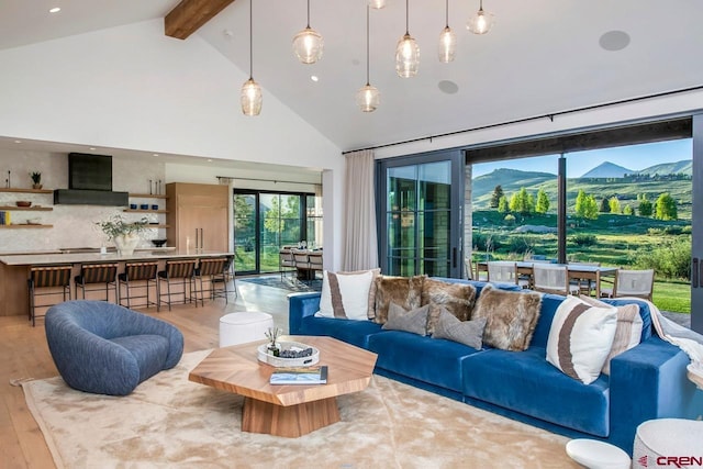 33 Aperture Ln, Crested Butte, CO 81224 - living room featuring high vaulted ceiling, beamed ceiling, wood finished floors, and recessed lighting