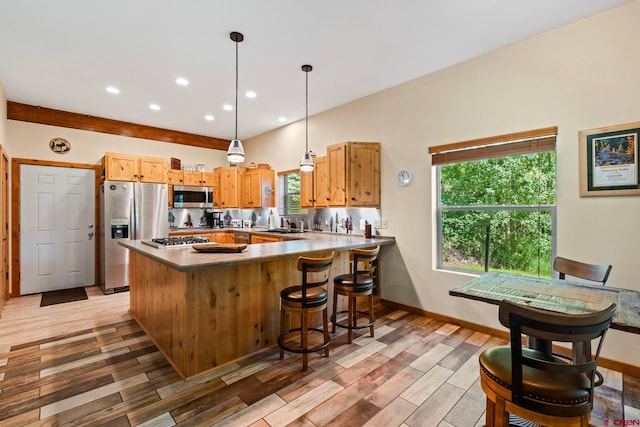 17401 County Road 501, Bayfield, CO 81122 - kitchen featuring appliances with stainless steel finishes, a peninsula, light wood-style floors, pendant lighting, and recessed lighting