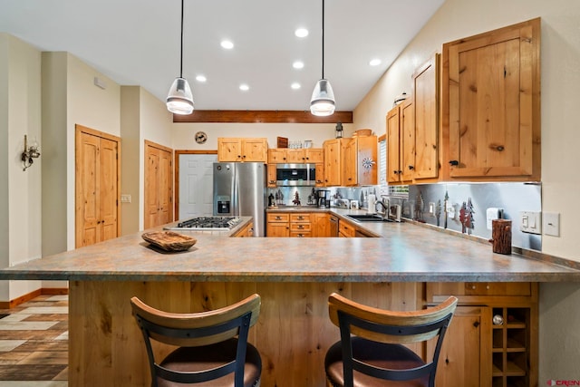 17401 County Road 501, Bayfield, CO 81122 - kitchen featuring appliances with stainless steel finishes, recessed lighting, a peninsula, a kitchen breakfast bar, and pendant lighting