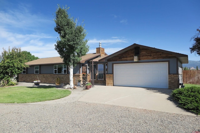 20657 Del Ray Dr, Eckert, CO 81418 - ranch-style house featuring driveway, brick siding, an attached garage, and a chimney