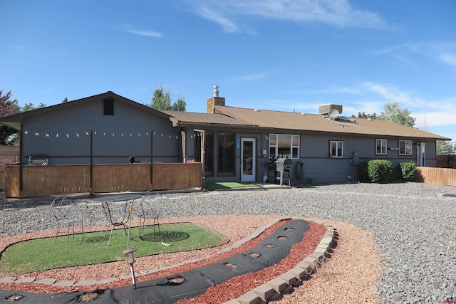 20657 Del Ray Dr, Eckert, CO 81418 - back of house with a putting area and a chimney