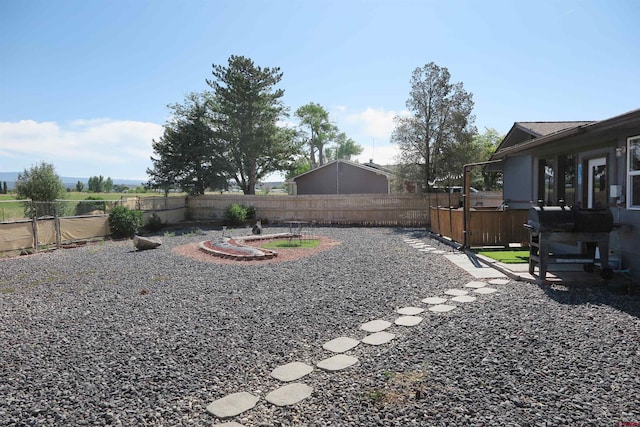 20657 Del Ray Dr, Eckert, CO 81418 - fenced backyard with a hot tub, a patio, and an outdoor fire pit