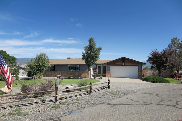 20657 Del Ray Dr, Eckert, CO 81418 - ranch-style home with an attached garage, concrete driveway, and brick siding