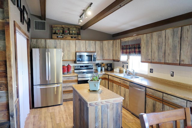 20657 Del Ray Dr, Eckert, CO 81418 - kitchen with appliances with stainless steel finishes, light wood-style flooring, a kitchen island, and light countertops