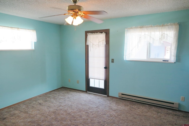 20657 Del Ray Dr, Eckert, CO 81418 - carpeted empty room featuring a baseboard heating unit, a ceiling fan, and a textured ceiling