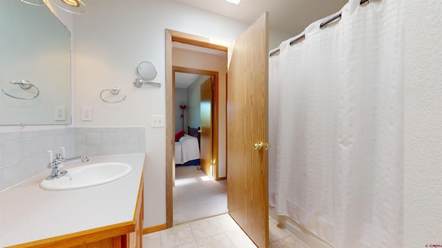 100 Paonia Ave, Paonia, CO 81428 - bathroom featuring vanity, a shower with shower curtain, and tile patterned floors