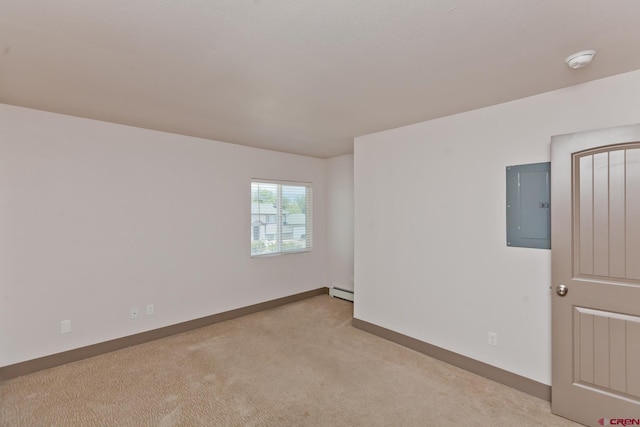 109 Anna Ct Unit 8B, Grand Junction, CO 81503 - empty room featuring electric panel, a smoke detector, light carpet, and baseboard heating