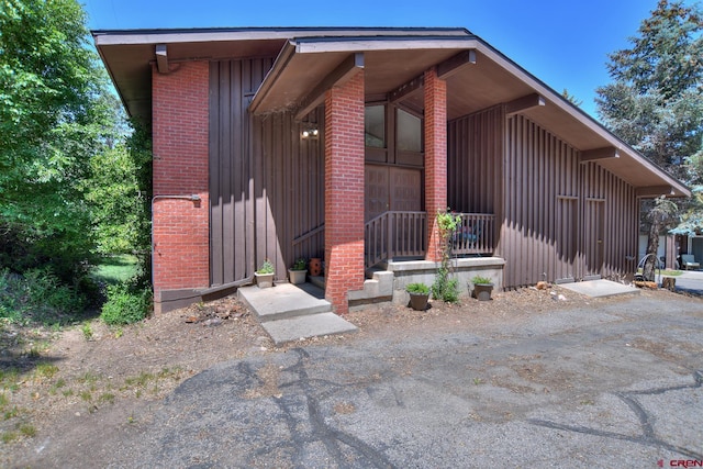 2920 Holly Ave Unit 104, Durango, CO 81301 - view of front of home featuring board and batten siding and brick siding