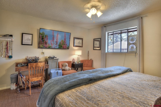2920 Holly Ave Unit 104, Durango, CO 81301 - bedroom featuring a textured ceiling and a ceiling fan