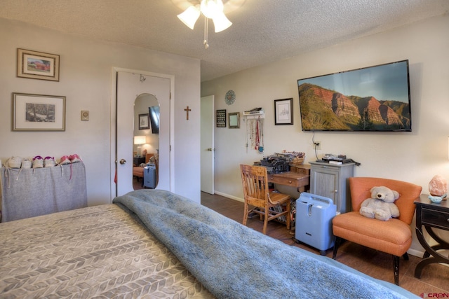 2920 Holly Ave Unit 104, Durango, CO 81301 - bedroom with wood finished floors, a textured ceiling, and ceiling fan