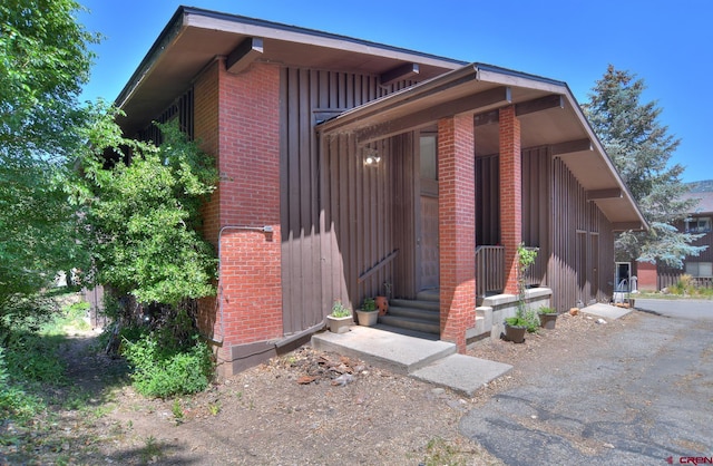 2920 Holly Ave Unit 104, Durango, CO 81301 - doorway to property with brick siding and board and batten siding
