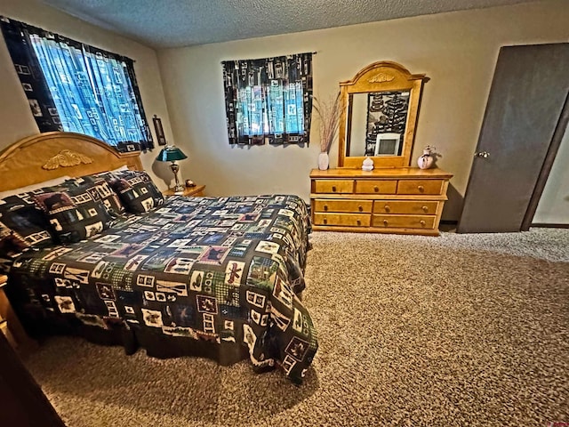 152 Conifer Dr, South Fork, CO 81154 - carpeted bedroom with a textured ceiling