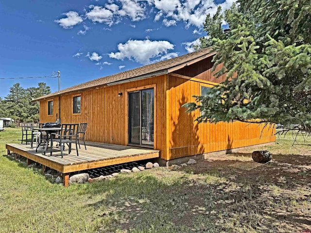 152 Conifer Dr, South Fork, CO 81154 - rear view of house with a deck, a yard, and outdoor dining area