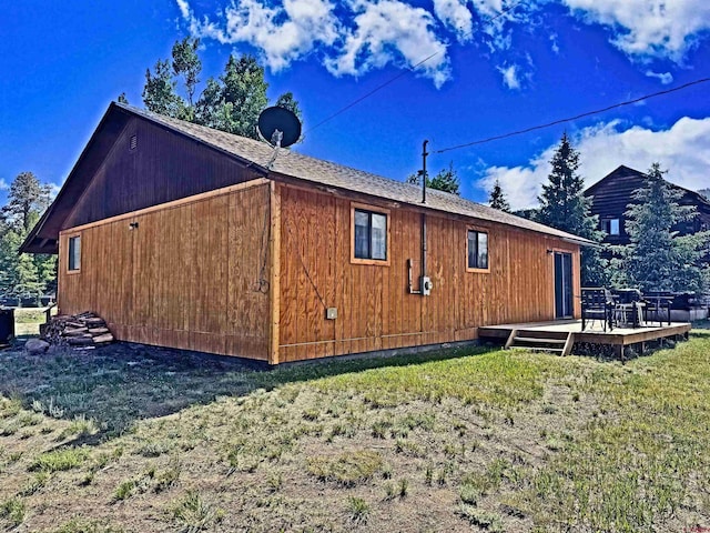 152 Conifer Dr, South Fork, CO 81154 - view of side of property with a wooden deck and a lawn