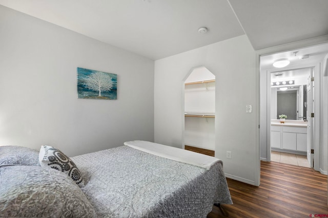 1100 Goeglein Gulch Rd Unit 171, Durango, CO 81301 - bedroom featuring wood finished floors and a walk in closet