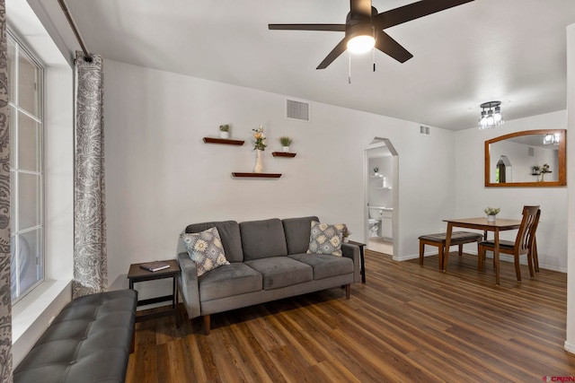 1100 Goeglein Gulch Rd Unit 171, Durango, CO 81301 - living area with arched walkways, wood finished floors, and a ceiling fan