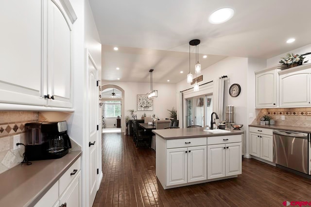 1734 Dry Creek Cir, Delta, CO 81416 - kitchen featuring dishwasher, recessed lighting, dark wood finished floors, backsplash, and white cabinets