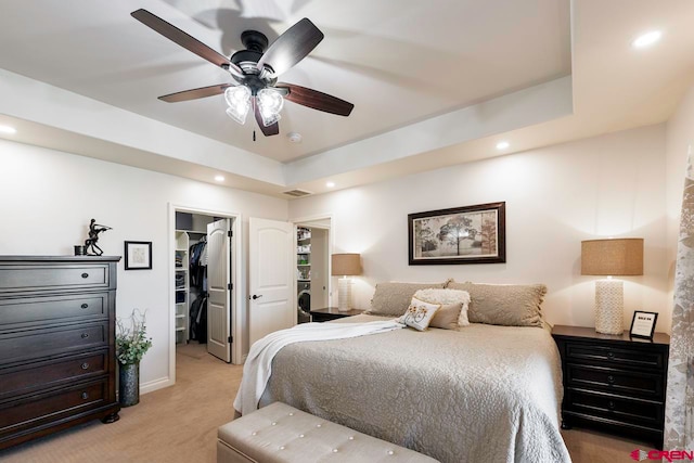 1734 Dry Creek Cir, Delta, CO 81416 - bedroom with a walk in closet, light colored carpet, recessed lighting, a closet, and ceiling fan