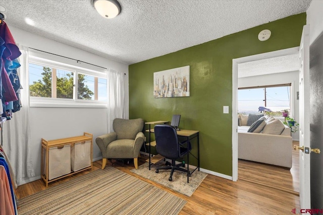 21932 2225th Rd, Cedaredge, CO 81413 - office area with a textured ceiling and wood finished floors