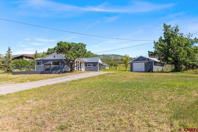 21932 2225th Rd, Cedaredge, CO 81413 - view of grassy yard featuring dirt driveway