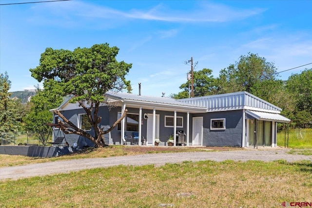 21932 2225th Rd, Cedaredge, CO 81413 - ranch-style home with stucco siding, a metal roof, and a front yard