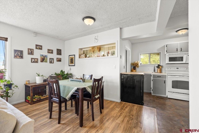 21932 2225th Rd, Cedaredge, CO 81413 - dining area with a textured ceiling and wood finished floors