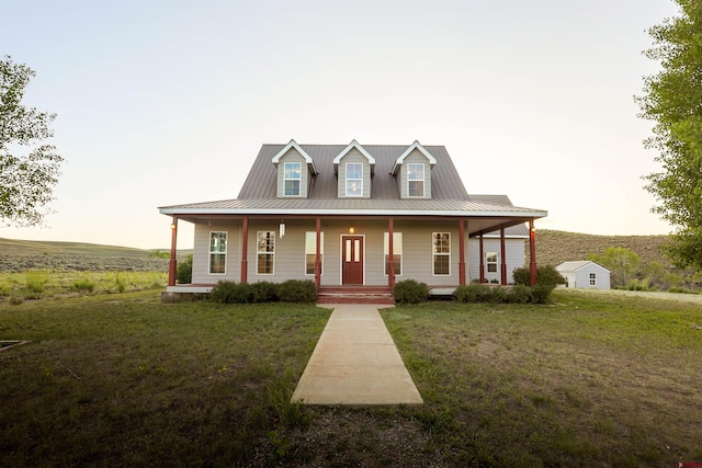 825 County Road 17, Gunnison, CO 81230 - farmhouse with a porch, a front lawn, and a metal roof