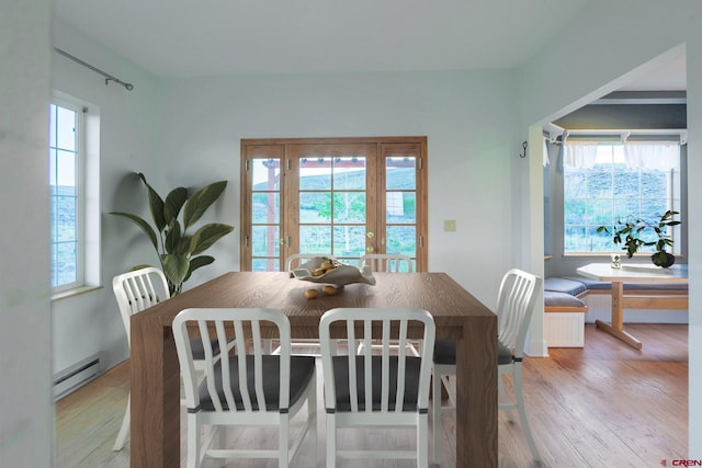 825 County Road 17, Gunnison, CO 81230 - dining area featuring baseboard heating, light wood-style floors, and french doors